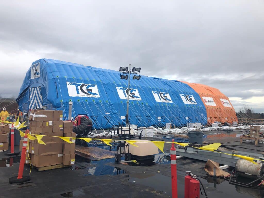 TGC-branded Njordair modules joined to cover a large roof area, with floodlighting