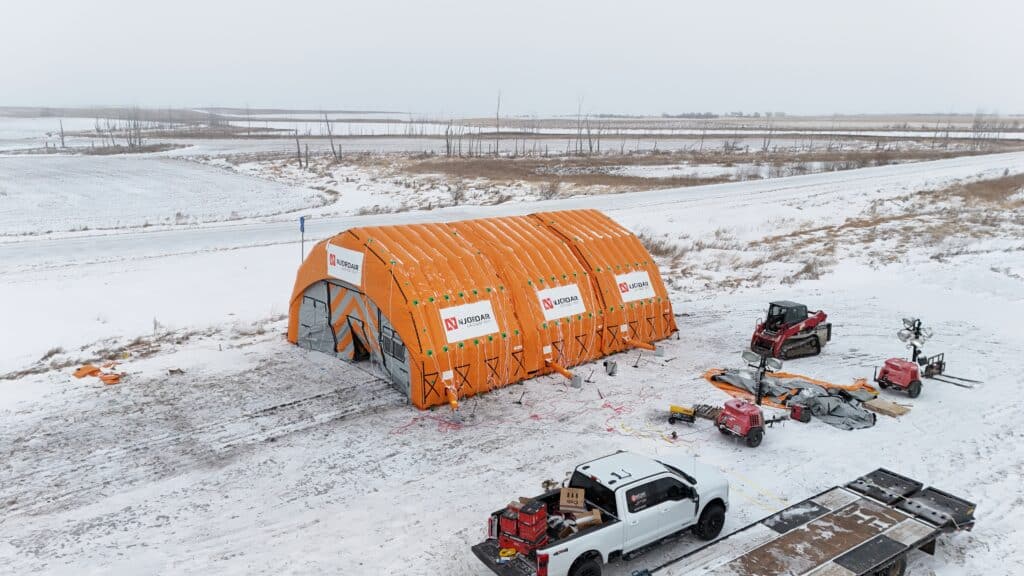 Njordair Constant Air enclosure sealed over a frozen 21,000-gallon frac tank on the North Dakota plains