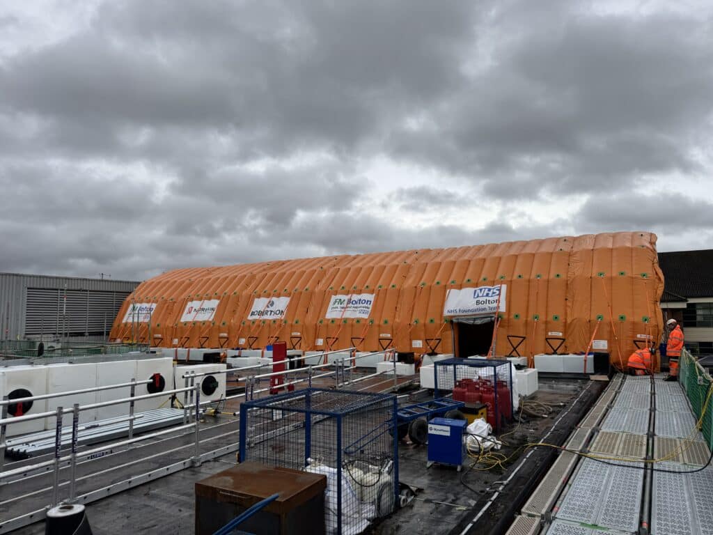 Njordair weather protection canopy running the length of the Bolton hospital roof